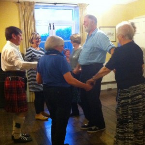 Ken-the-kilt and Anne lead a reel